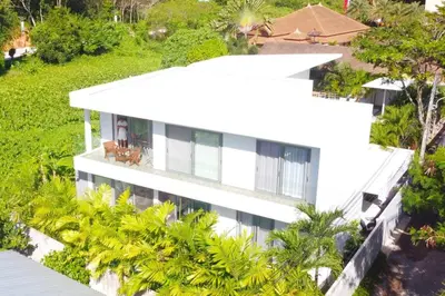 an aerial view of a white house with palm trees at Modern pool villa 3 bedrooms in Rawai Beach