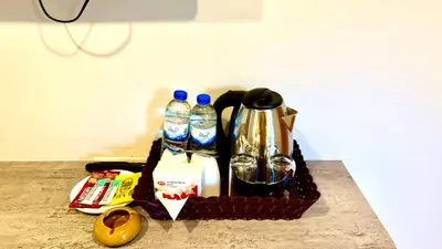 a basket with bottles of water and drinks on a counter at KS Residence Patong in Patong Beach
