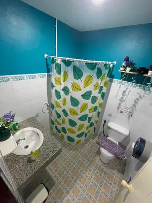 a bathroom with a toilet and a sink and a shower at Ciao Bella GuestHouse & Bistro in Kata Beach