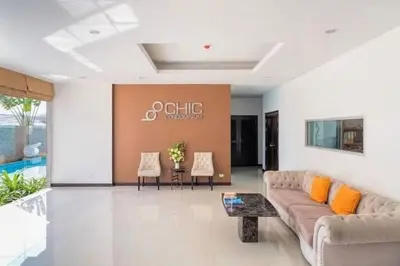 a living room with a couch and a table at Сhic condo студия с бассейном in Karon Beach