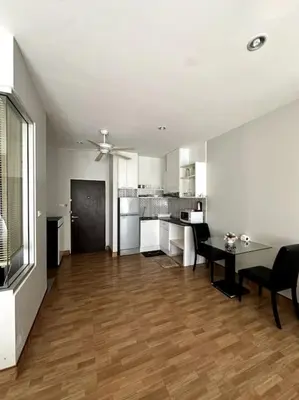 a living room with a table and a kitchen at Сhic condo студия с бассейном in Karon Beach