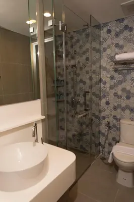 a bathroom with a sink and a toilet and a shower at Laguna Lakeside Apartment Phuket Bang Tao in Bang Tao Beach