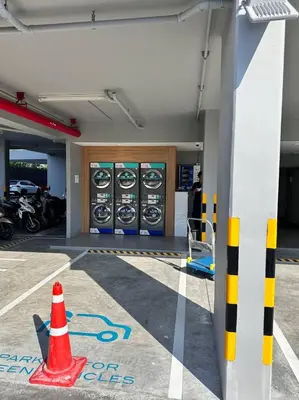 a gas station with a orange cone in front of machines at Laguna Lakeside Apartment Phuket Bang Tao in Bang Tao Beach