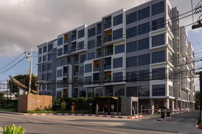 a large building on the side of a street at Laguna Lakeside Apartment Phuket Bang Tao in Bang Tao Beach
