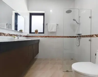 a bathroom with a shower and a toilet and a sink at Krabi Private Pool Villa 2 by Belcarra Spaces in Ban Khlong Haeng