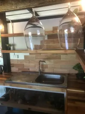 a kitchen sink with two glass bowls above it at Cancel in Phang-nga