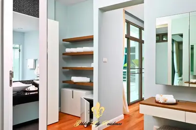 a bathroom with a mirror and a sink at Golden Lily 4 Bedroom Private Pool Villa in Rawai Beach