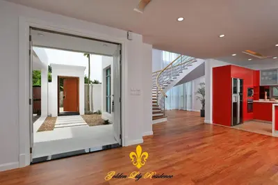 a hallway of a home with a staircase and a house at Golden Lily 4 Bedroom Private Pool Villa in Rawai Beach