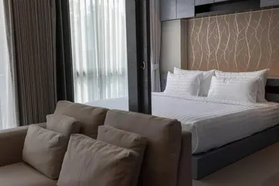 a bedroom with a large bed and a couch at 600m to beach New City gate P214 #c60 in Kamala Beach