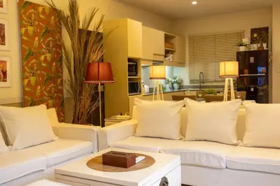 a living room with two white couches and a table at Most Beautiful Relaxation Garden Villa V86 in Rawai Beach