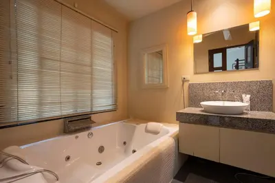 a large bathroom with a tub and a sink at Most Beautiful Relaxation Garden Villa V86 in Rawai Beach