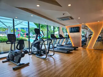 a gym with treadmills and elliptical machines at 2 BDR Suite in 5 Star Hotel in Rawai Beach