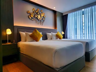 a bedroom with two beds and a large window at 2 BDR Suite in 5 Star Hotel in Rawai Beach