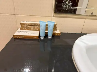 two stacks of books sitting on a table in a bathroom at sun flower \u4e00\u5367\u7cbe\u54c1\u5927\u5e8a\u623f in Patong Beach