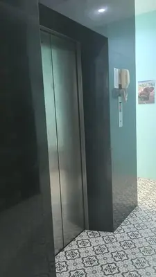 a elevator in a bathroom with a glass door at sun flower \u4e00\u5367\u7cbe\u54c1\u5927\u5e8a\u623f in Patong Beach