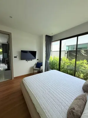 a bedroom with a large bed and a large window at Вилла 2 санузла, 2 спальни in Ban Suan