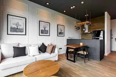 a living room with a couch and a table at Saturdays Residence 1 bedroom Rawai in Ban Saiyuan (1)