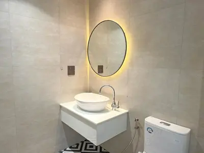 a bathroom with a sink and a mirror on the wall at The Title Halo1 2BD by MILL in Phuket
