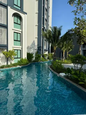 a swimming pool in front of a building at The Title Halo1 2BD by MILL in Phuket