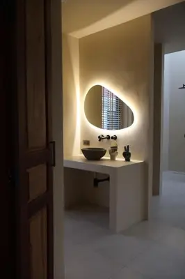 a bathroom with a sink and a mirror at Villa Cabana in Ban Saiyuan (1)