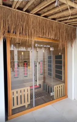 a store front with a glass door with a straw roof at Villa Cabana in Ban Saiyuan (1)