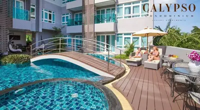 a view of a swimming pool at a hotel at Calypso condo in Rawai Beach