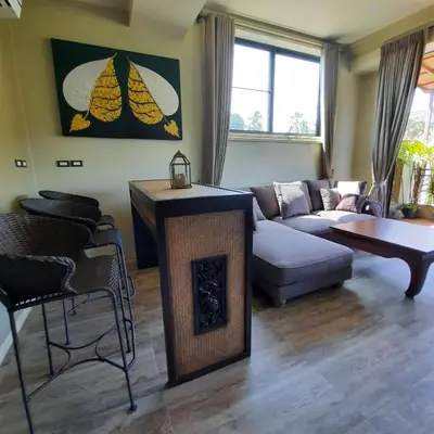 a living room with a couch and a fireplace at Naiharn high view villa in Rawai Beach