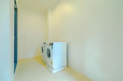 a washing machine is sitting in a room at Sava Villa near Rawai in Ban Saiyuan (1)