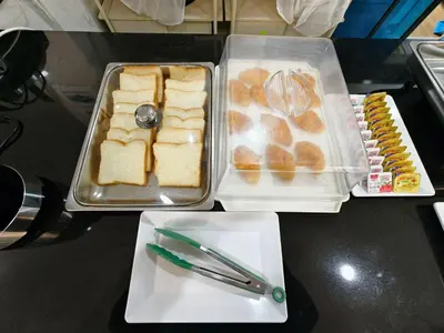 a table with two trays of food on a table at The Answer Hotel in Ao Nang Beach