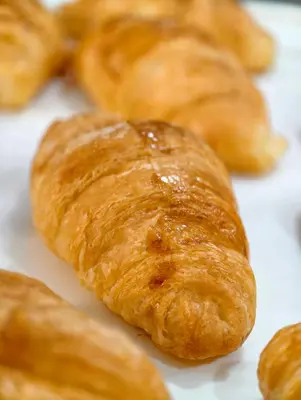 a group of croissants sitting on top of a table at The Answer Hotel in Ao Nang Beach