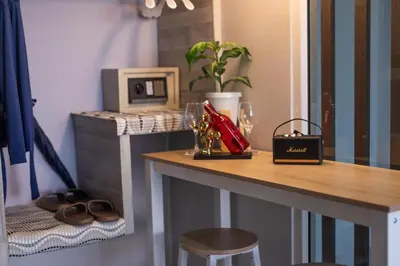 a counter with a table with glasses and a plant at Best Time Pool Suites in Chalong