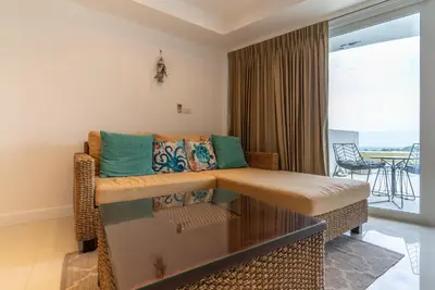 a living room with a couch and a table at Apartment Kata Ocean View in Kata Beach