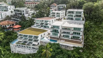 an aerial view of a city with white buildings at Apartment Kata Ocean View in Kata Beach