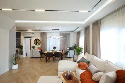 a living room with a couch and a table at Phuket Paradise Retreat in Phuket Town