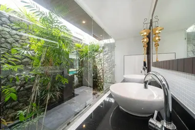 a bathroom with a sink and a shower with plants at Laguna luxury pool villa 3 bedroom in Phuket