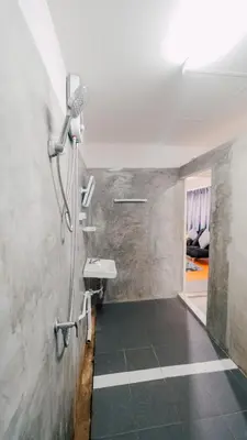 a bathroom with a shower and a sink at P&I Group Nana apartments 2&3 in Karon Beach