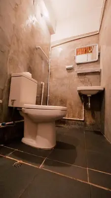 a bathroom with a toilet and a sink at P&I Group Nana apartments 2&3 in Karon Beach