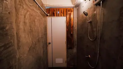 a bathroom with a shower stall and a toilet at P&I Group Nana apartments 2&3 in Karon Beach