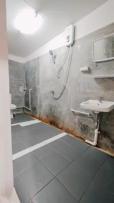 a bathroom with a shower and a sink at P&I Group Nana apartments 2&3 in Karon Beach