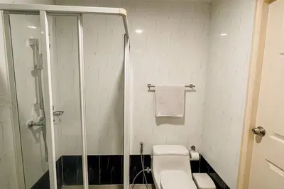 a bathroom with a shower and a toilet and a sink at Rawai Palm Beach Квартира 220м in Rawai Beach