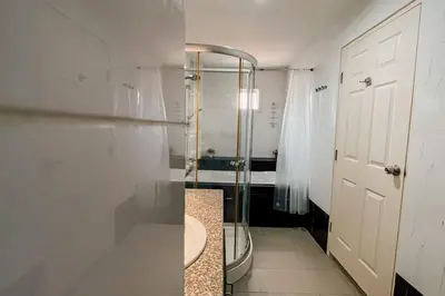 a bathroom with a shower and a white door at Rawai Palm Beach Квартира 220м in Rawai Beach