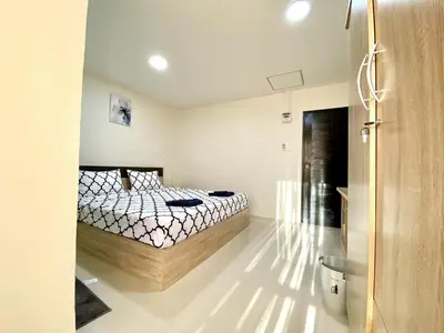 a bedroom with a bed in a room at Vista Residence Patong in Patong Beach
