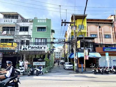 a group of motorcycles parked on a city street at Vista Residence Patong in Patong Beach