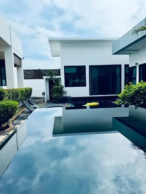 a swimming pool in the backyard of a house at Funtime pool villa in Kata Beach