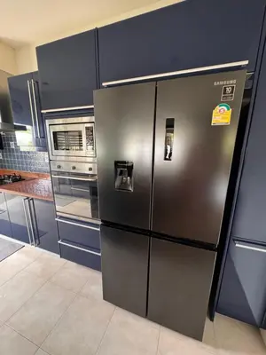 a kitchen with a stainless steel refrigerator in a kitchen at Villa on Panwa with 2 house keepers in Ban Bo Rae