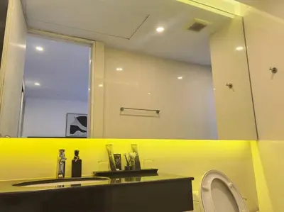 a bathroom with a sink and a mirror and a toilet at little princess \u5c0f\u516c\u4e3b\u522b\u5885 in Patong Beach