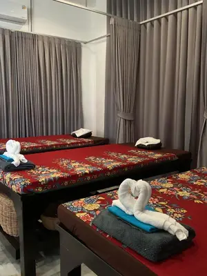 a room with three beds with towels on them at Diva Boutique Hotel in Patong Beach