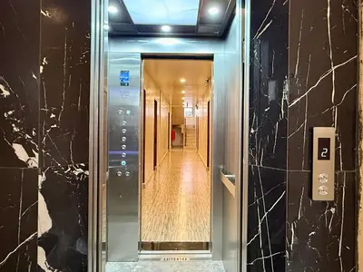 a hallway in a building with a glass door at Diva Boutique Hotel in Patong Beach