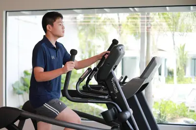a man on a treadmill in a gym at Lalynn Resort & Villas, Phuket in Thalang