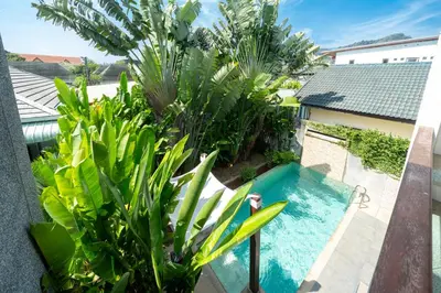 an overhead view of a swimming pool with plants at The fin villa rawai 2 bedroom in Ban Saiyuan (1)